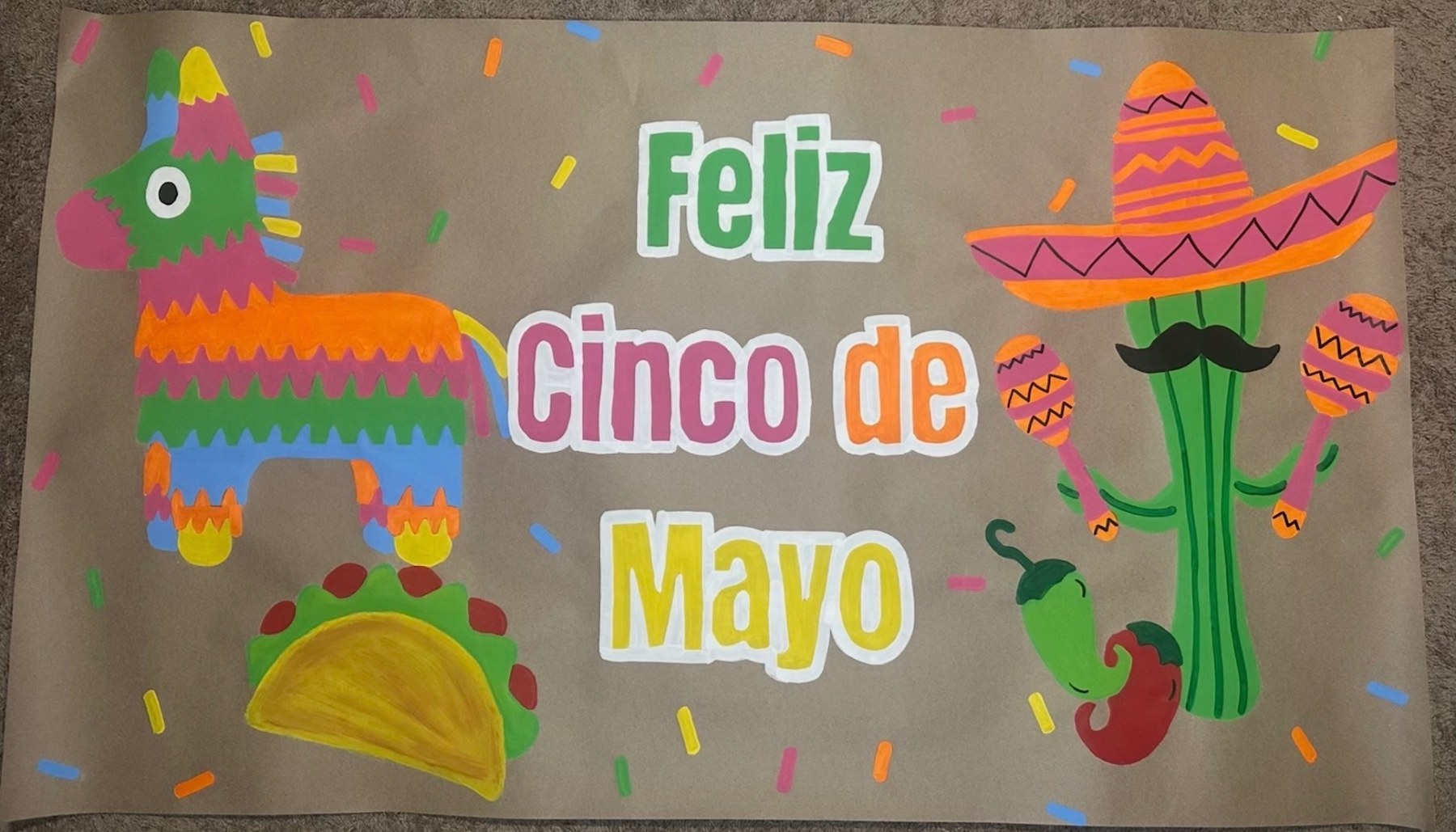 Hand-painted 'Feliz Cinco de Mayo' banner with piñata, cactus, and taco by Lori